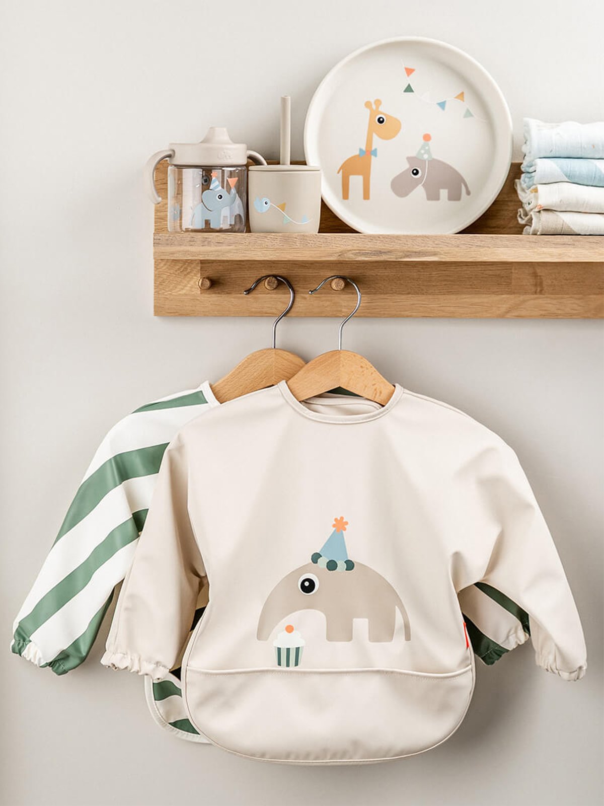 Done by Deer Sleeved pocket bib Celebration Sand